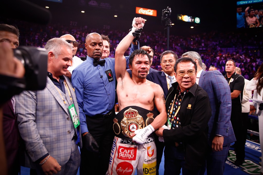 MANNY PACQUIAO EDGES KEITH THURMAN BY SPLIT DECISION TO CAPTURE WELTERWEIGHT WORLD&nbsp;TITLE